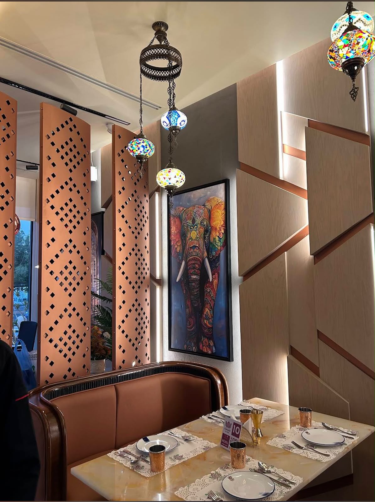 Taj Mahal booth seating with hand-painted elephant artwork